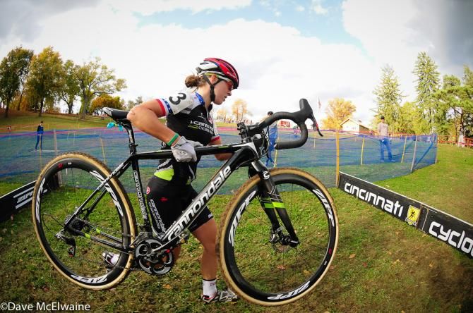 Kaitie Antonneau (Cannondale/ Cyclocrossworld.com) running barriers at the bottom of the course