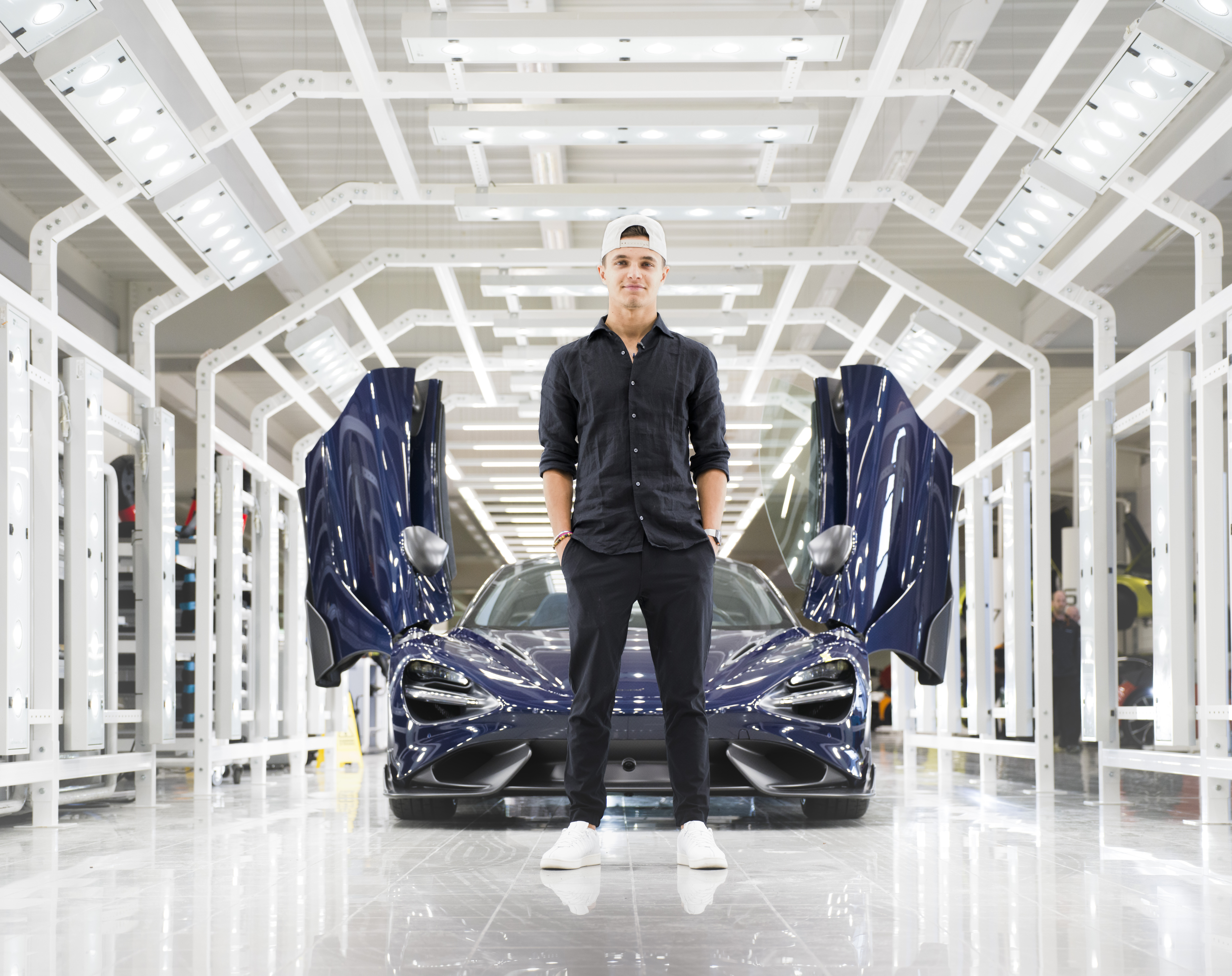 lando norris in front of his bespoke 765LT