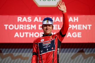 Remco Evenepoel (Soudal-Quickstep) on the podium of race leader in the 2023 UAE Tour after stage 5