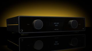 Arcam A50 amplifier in black on a black and yellow background