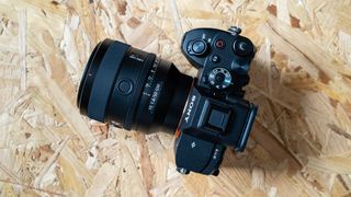 The Sony FE 50mm f1.4 on a chipboard surface