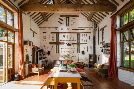 living room with impressive tool display on far wall