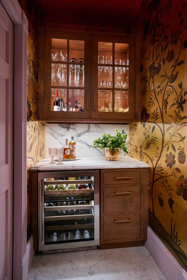 a bar with a lilac and gold color palette