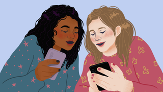 Two teenage girls using mobile phones together