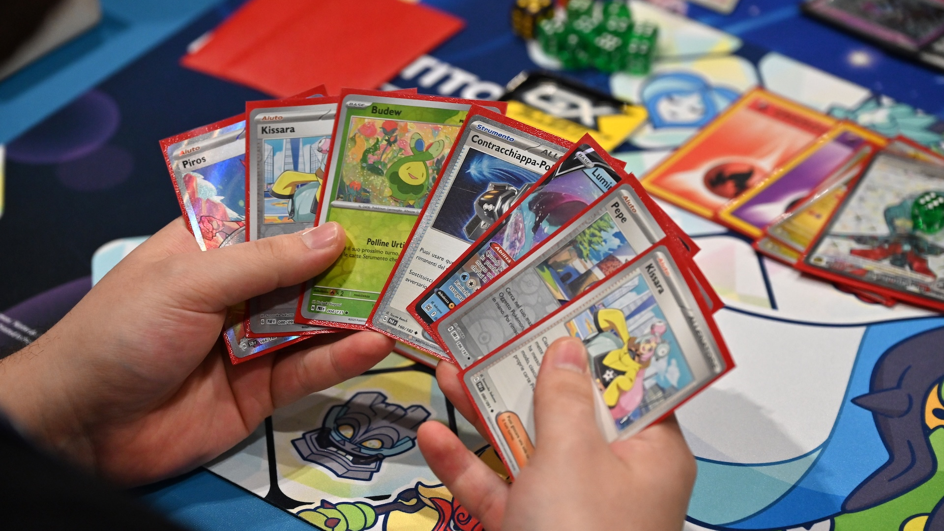 Pok&eacute;mon cards being used on a table 