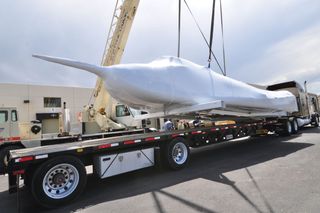 Dream Chaser Atop Flatbed Truck and Trailer