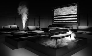 Grey seating in dim lit room and smoke coming from vents
