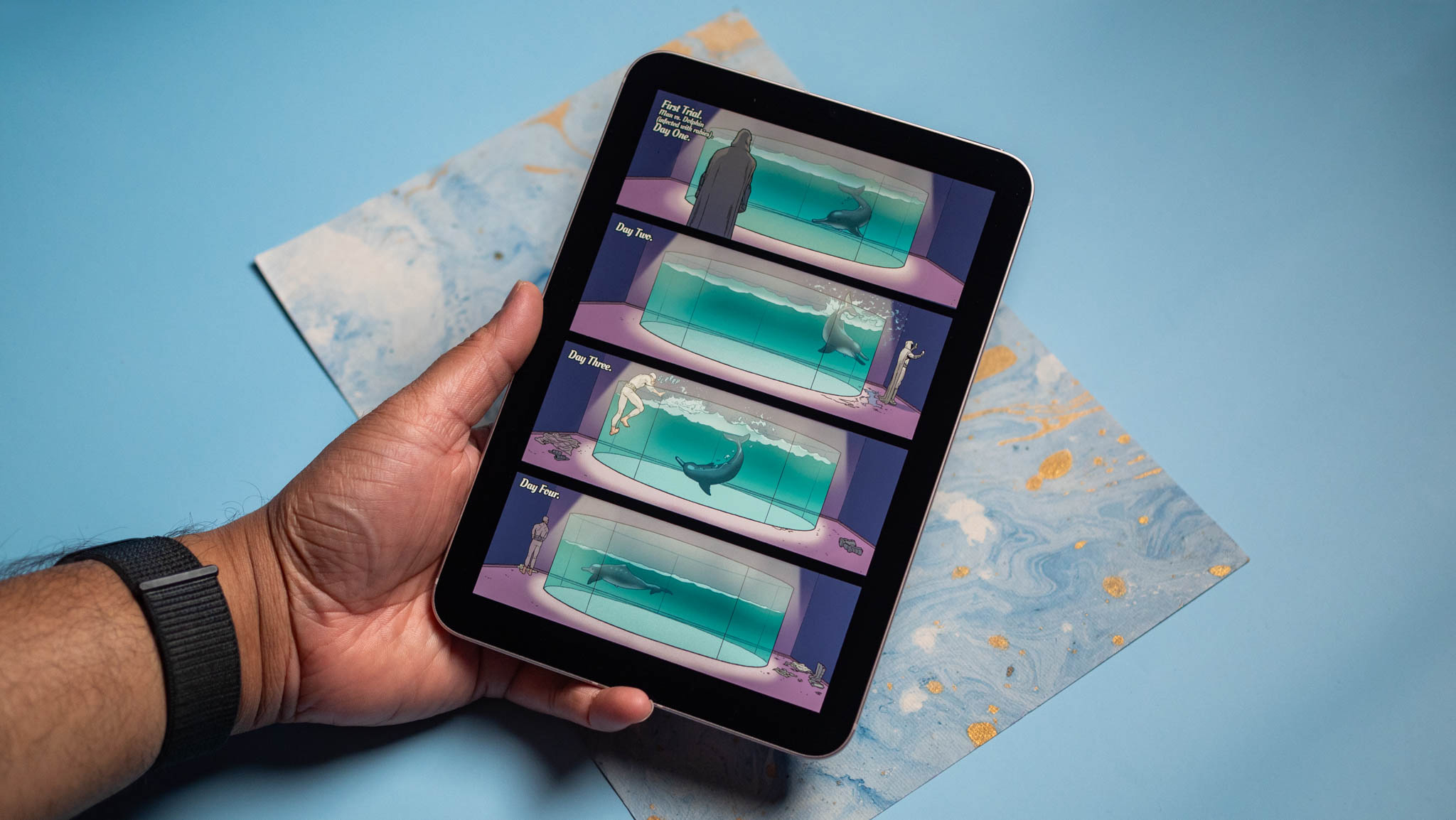 Apple iPad mini with a comic book