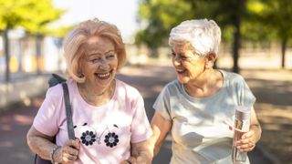 two senior women walking