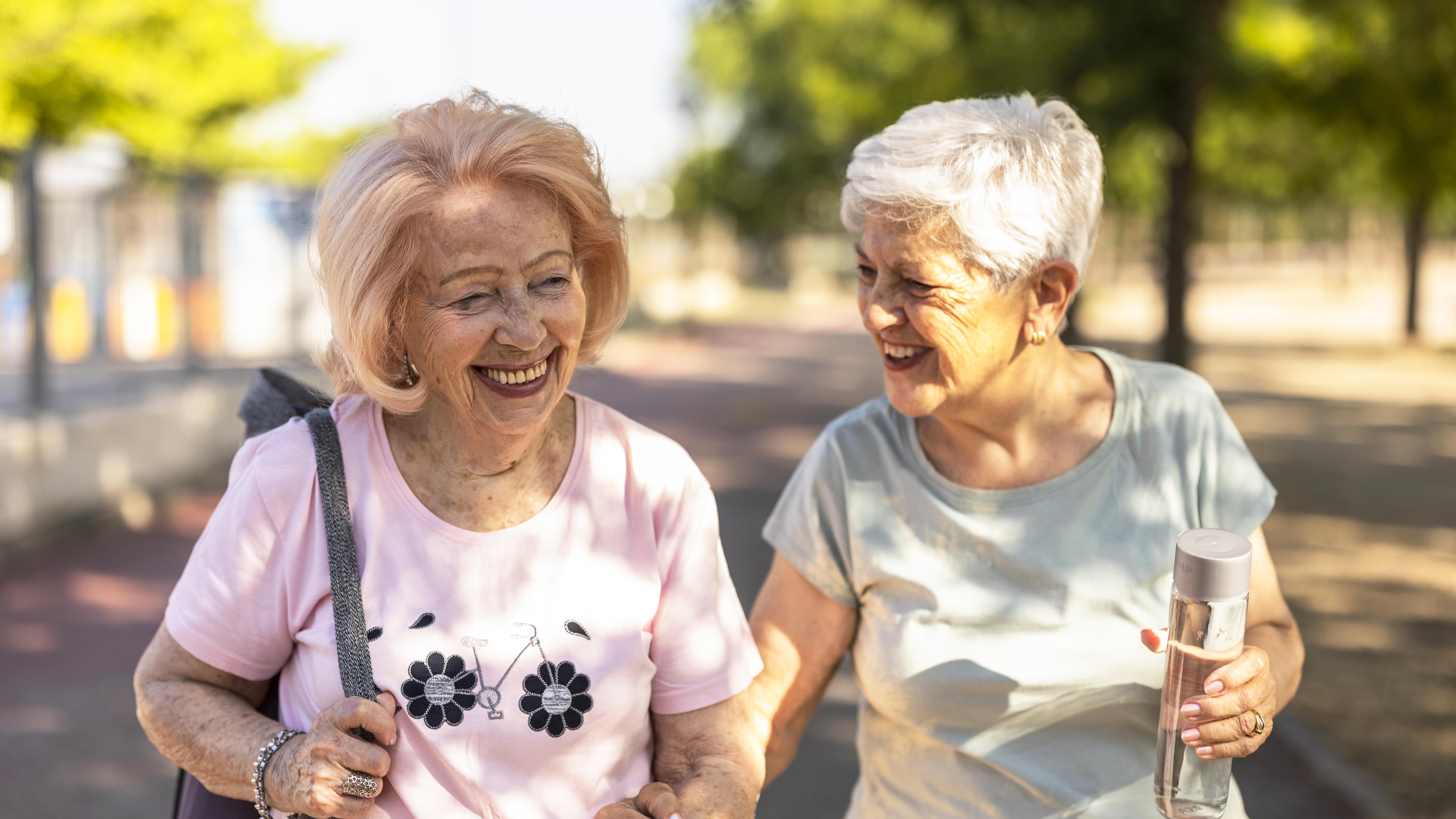 two senior women walking