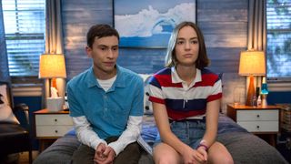 Keir Gilchrist as Sam and Brigette Lundy-Paine as Casey sit on a bed in Atypical