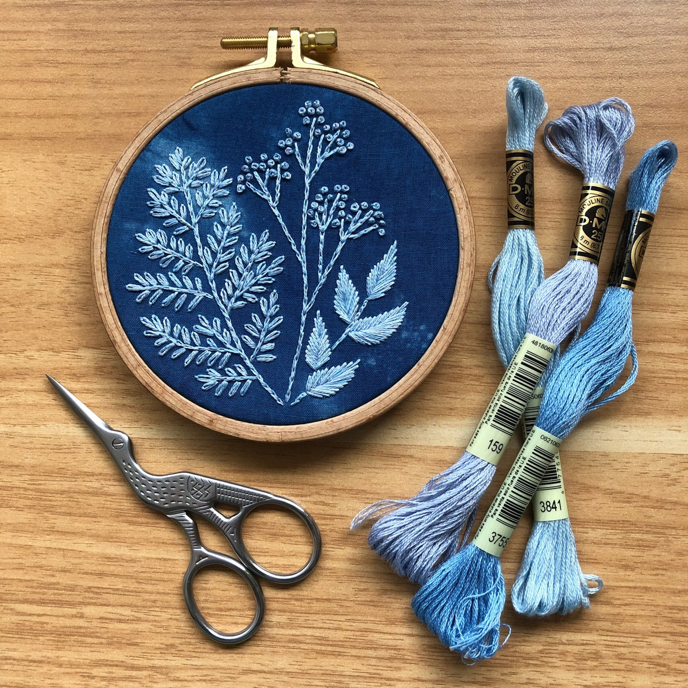 Blue cyanotype style embroidery design
