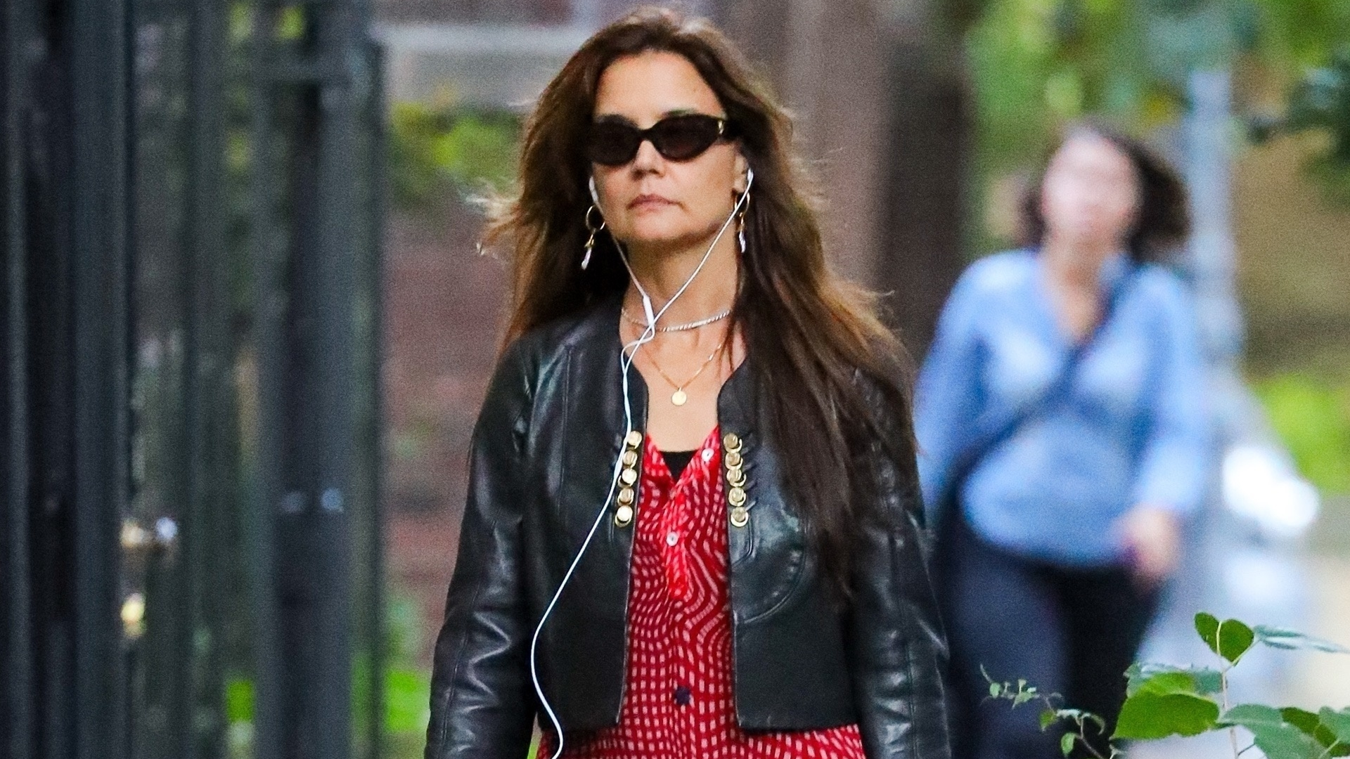 Katie Holmes was spotted in New York wearing tomato red ballet flats, a matching shirt dress, and black leggings