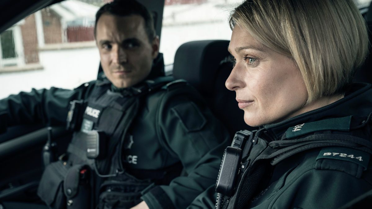 Grace (Sian Brooke) and Stevie (Martin McCann) in police gear in Blue Lights