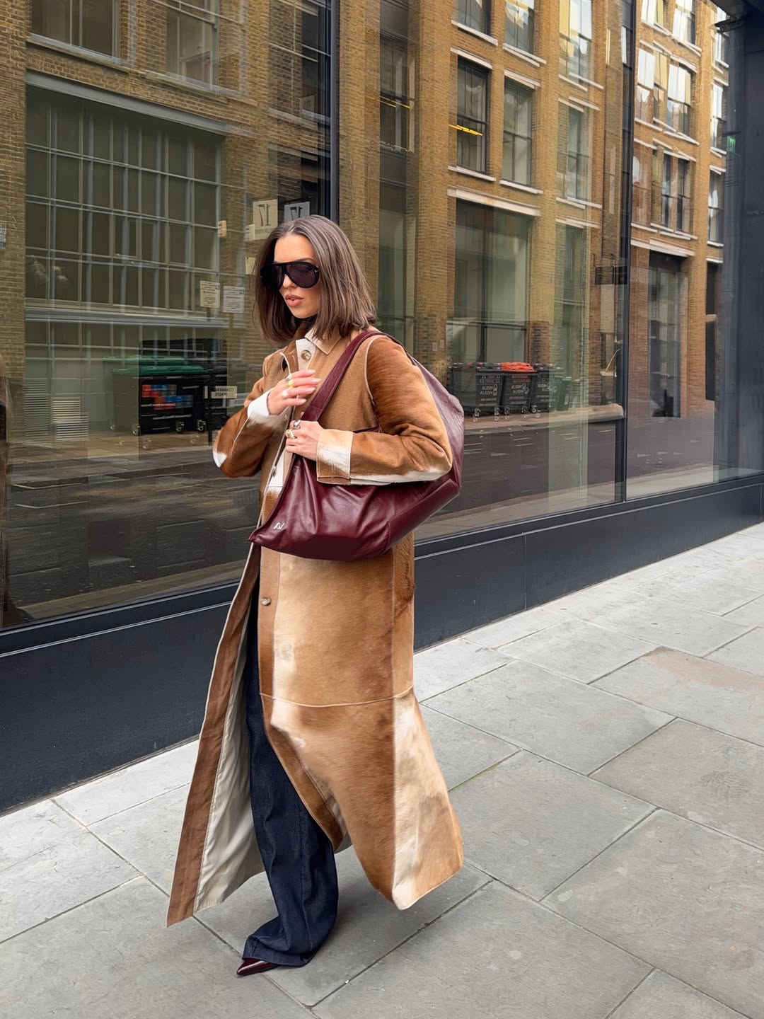 woman wearing oversize sunglasses outfit 2026