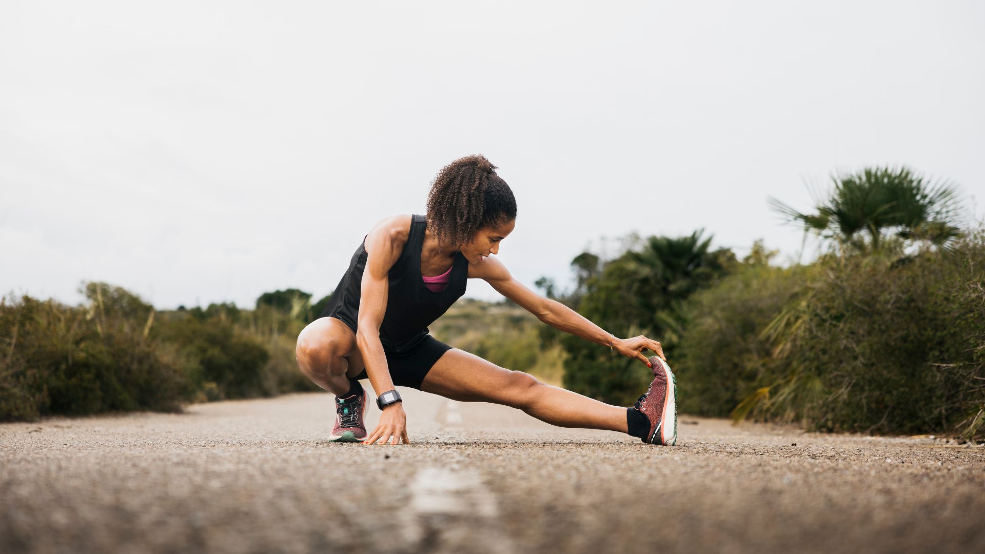Woman stretching while out running