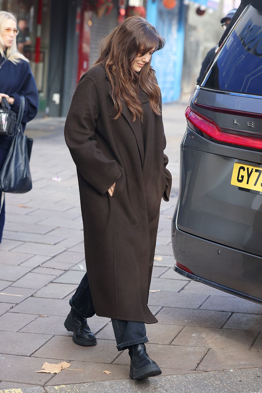 Elizabeth Olsen wearing an oversized brown wool coat