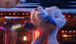 Smallfoot stands in front of a bar, looking really nervous