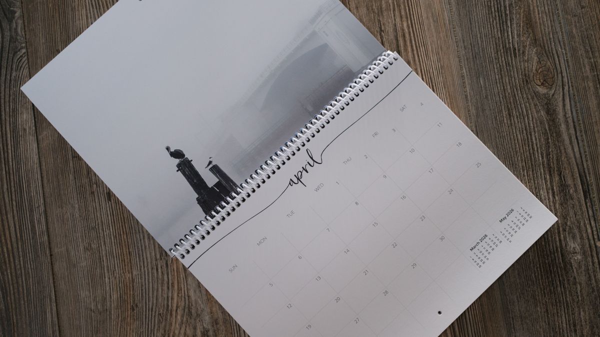 A photo calendar from Nations Photo Lab on a wood background