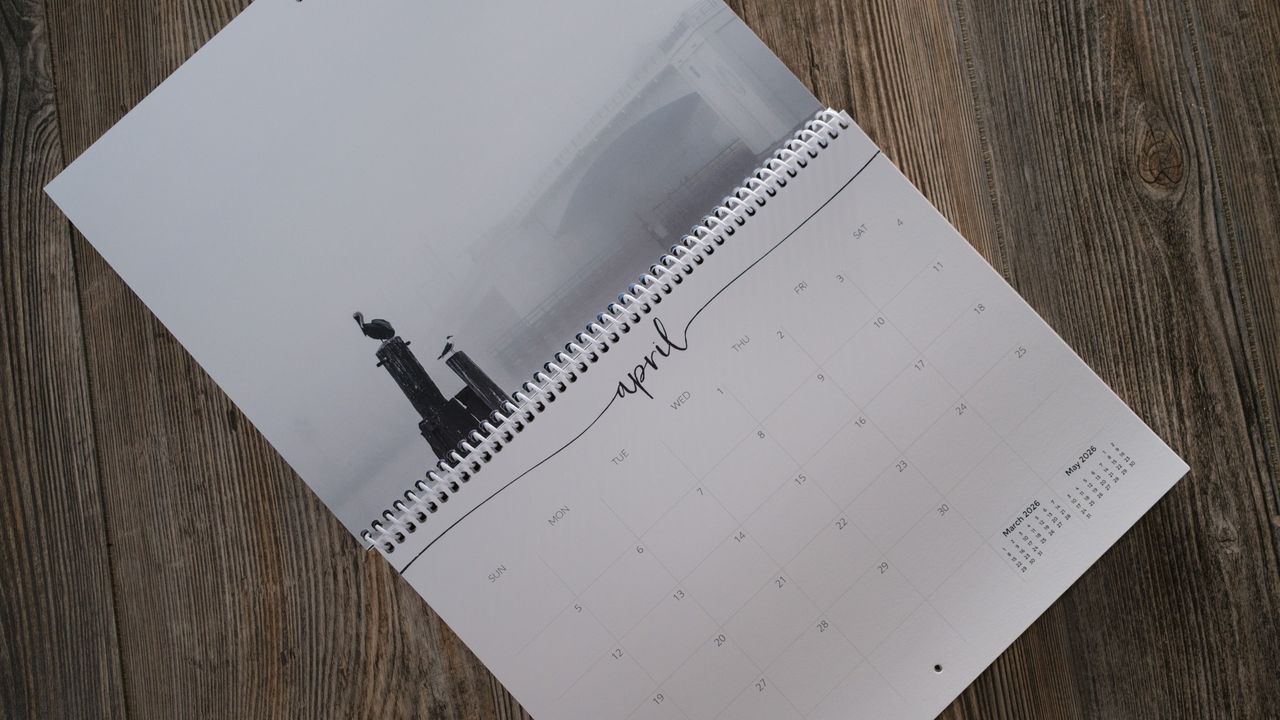 A photo calendar from Nations Photo Lab on a wood background