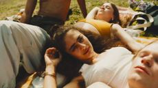 teenagers relax on grass