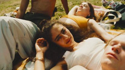 teenagers relax on grass