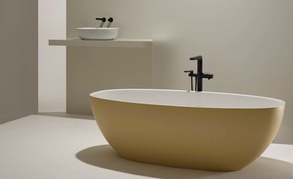 Yellow minimalist bathtub by Victoria + Albert for House of Rohl