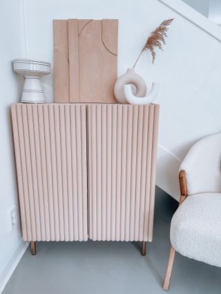 A pink, fluted sideboard