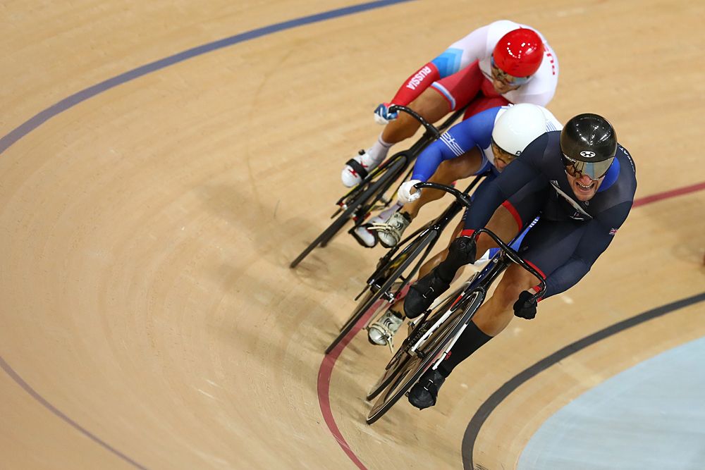 Callum Skinner of Great Britain, Christos Volikakis of Greece, Denis Dmitriev of Russia compete during the Men's Keirin First Round Repechages