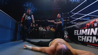 Kevin Owens standing over Sami Zayn at Elimination Chamber 2025.