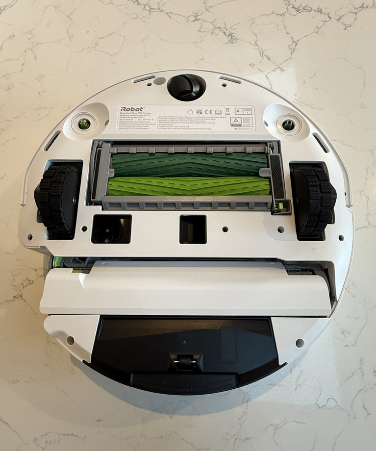 The underside of the Roomba 705 vacuum that shows its rubber rollers, bottom of the water tank and mop cover
