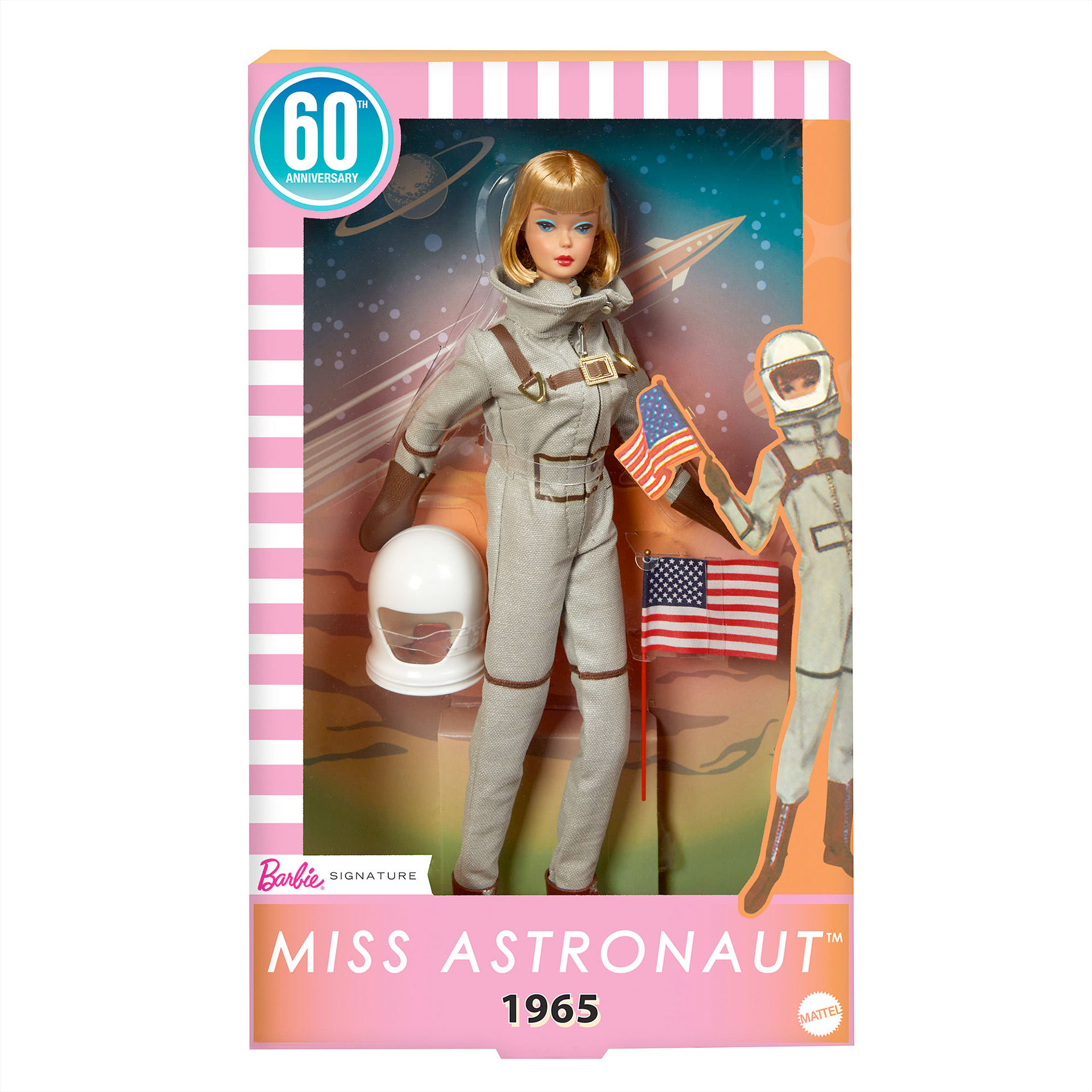 a reproduction of a vintage astronaut Barbie doll is seen inside its packaging