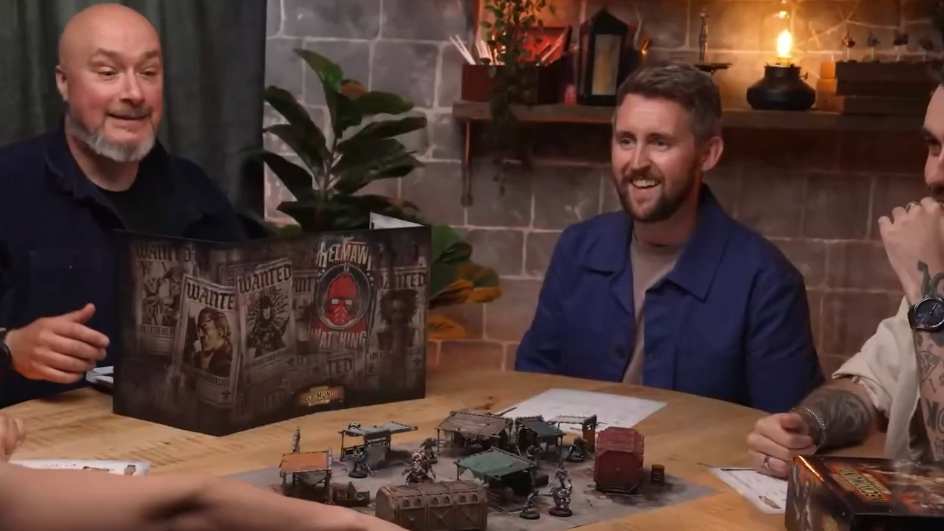 A group of players around the table playing Necromunda RPG