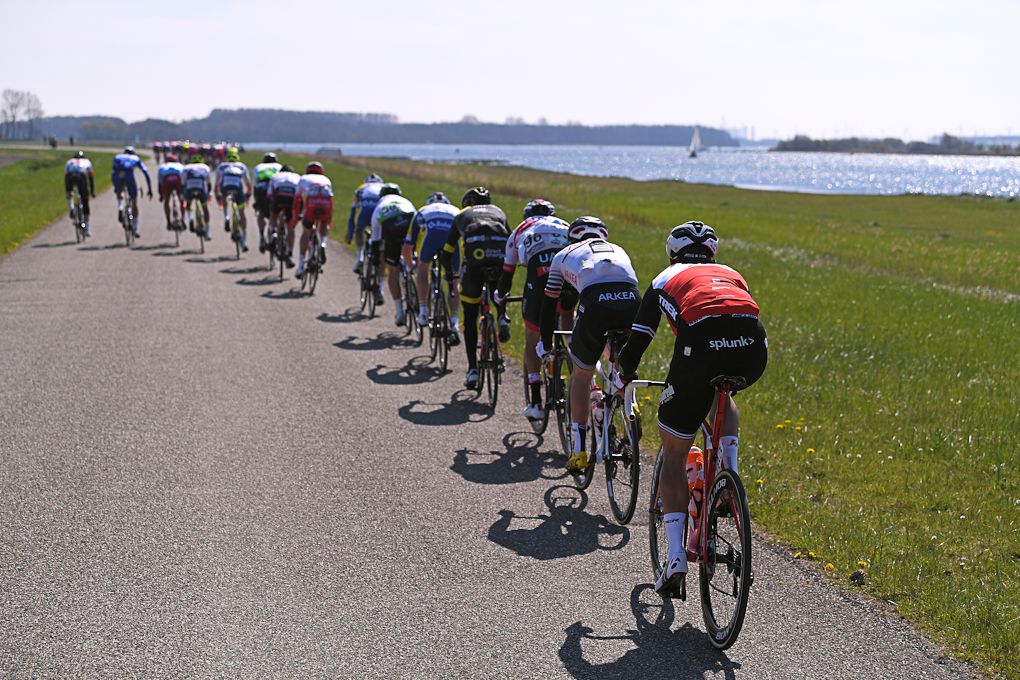 The Scheldeprijs peloton riding along the exposed coastline