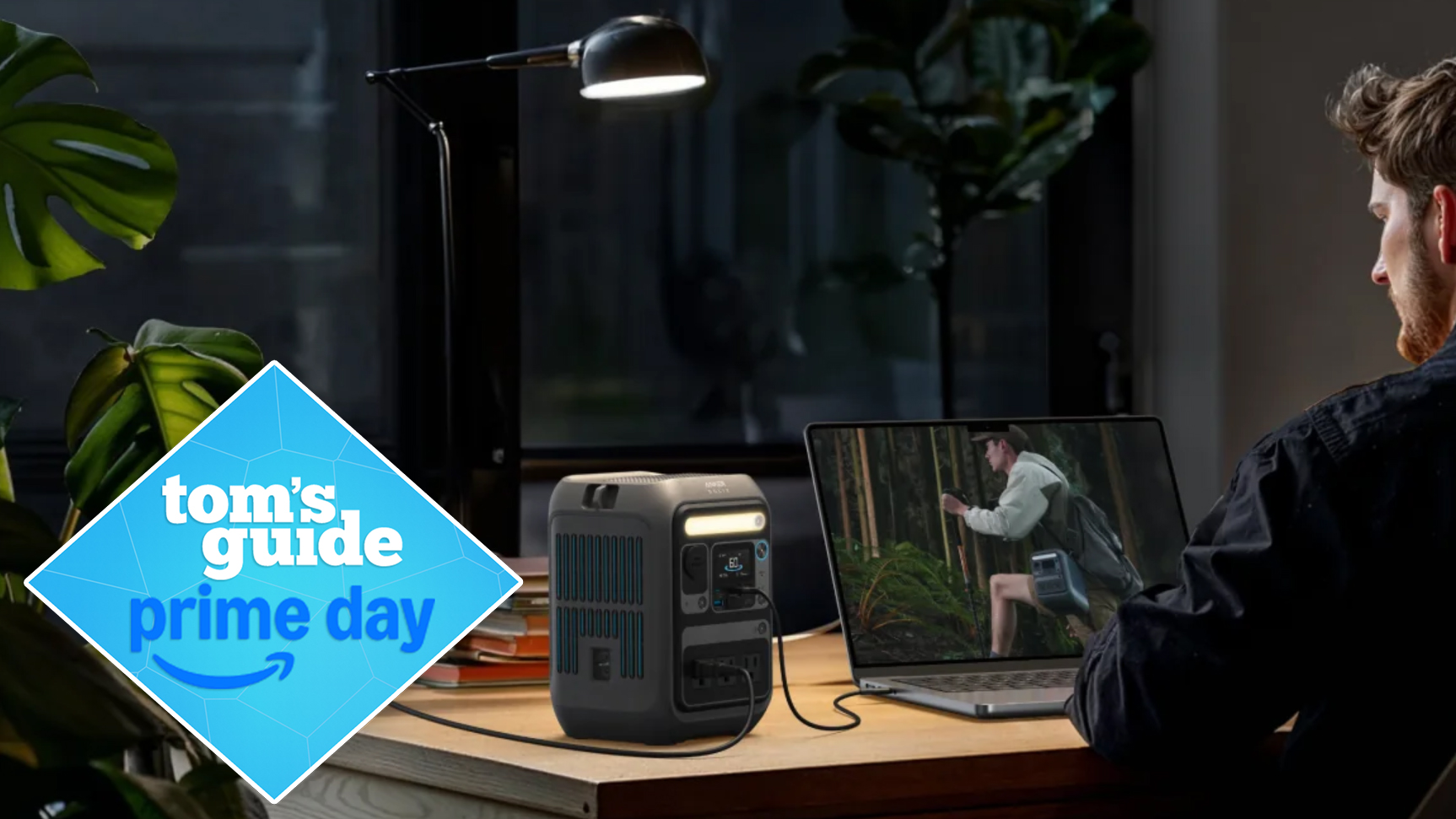 anker solix c300 powering a light and laptop with a prime day deal tag