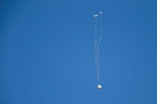 Drogue parachutes extract the three main parachutes from Blue Origin's New Shepard crew capsule during its return to Earth in a Jan. 22, 2016 test flight.
