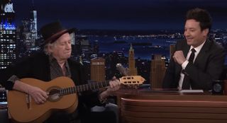 Keith Richards (left) plays guitar as Jimmy Fallon looks on