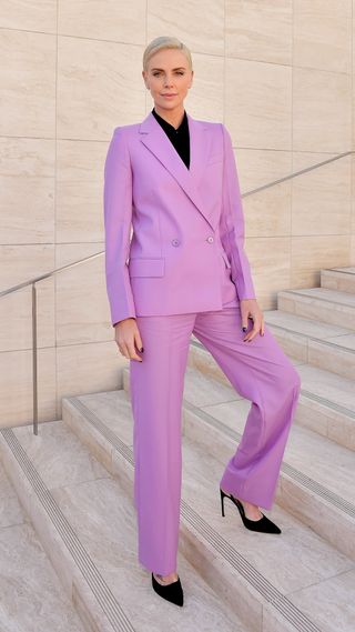 Charlize Theron in a purple suit