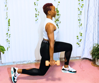 Personal trainer Elethia Gay demonstrates a lunge