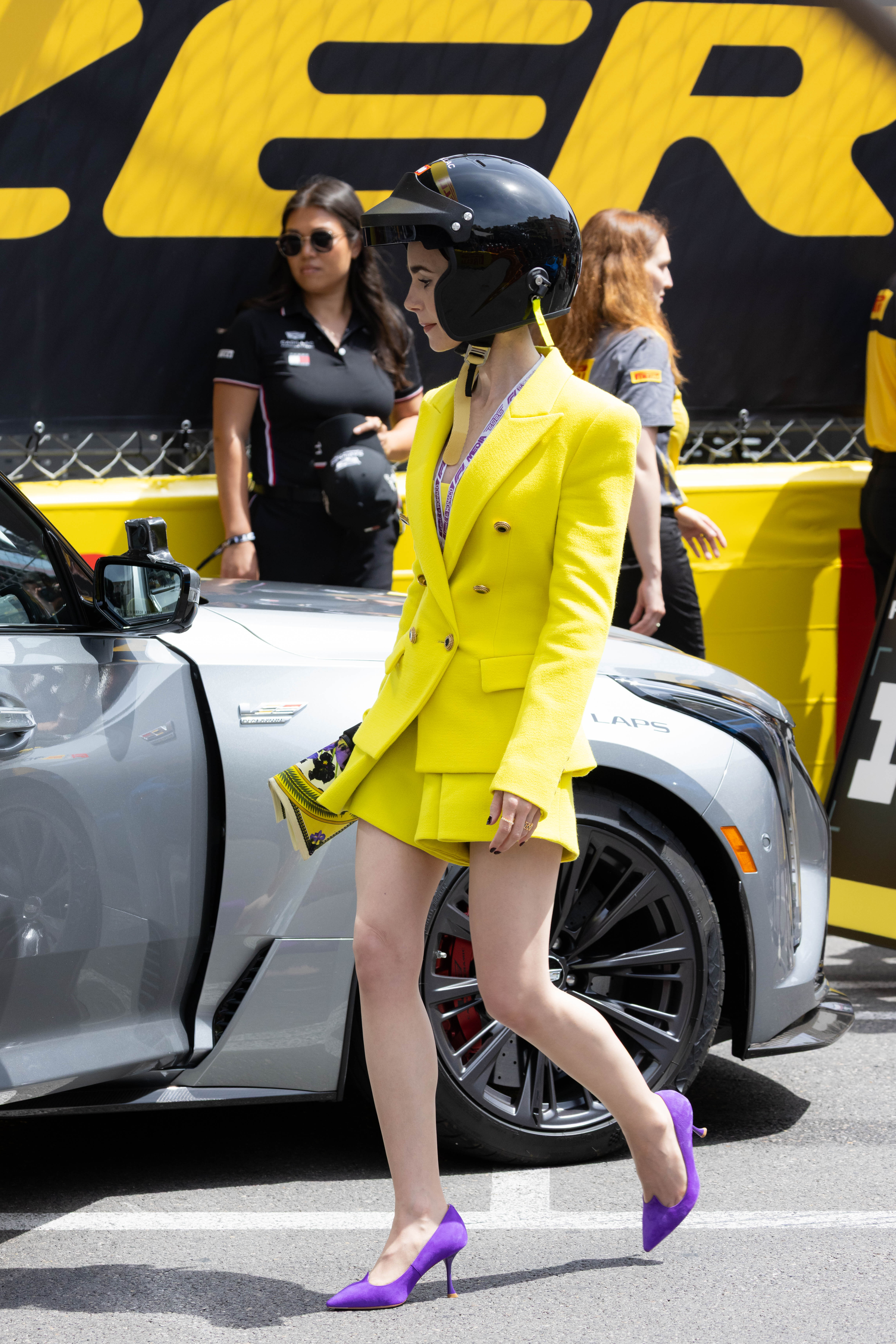 Lily Collins pulled off a neon green and purple color combination at the Formula 1 Monaco Grand Prix