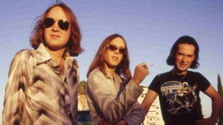 Urge Overkill posing for a photograph