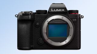 The Panasonic Lumix S5 camera on a blue background