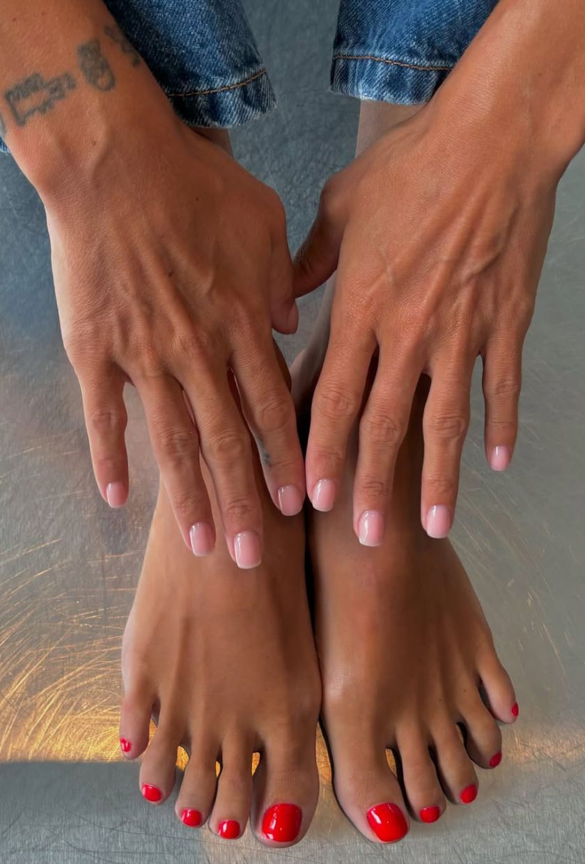 Pink manicure and red pedicure