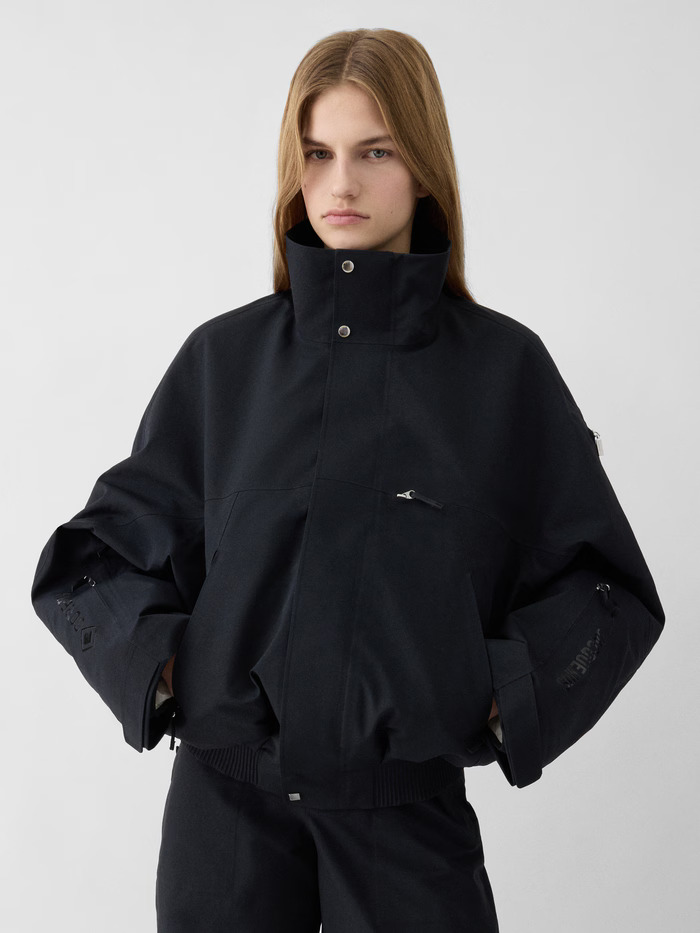 a model wearing a jacquemus x nike ski jacket
