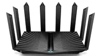 TP-Link Archer AX90 (AX6600) wireless router shown on a white background. The router has a massive eight antennas.