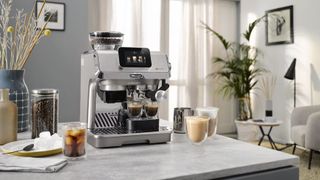 De’Longhi La Specialista Touch coffee machine with drinks on kitchen counter