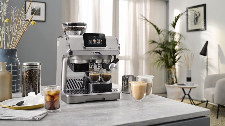 De’Longhi La Specialista Touch coffee machine with drinks on kitchen counter