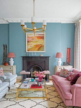 Blue living room with a pink sofa