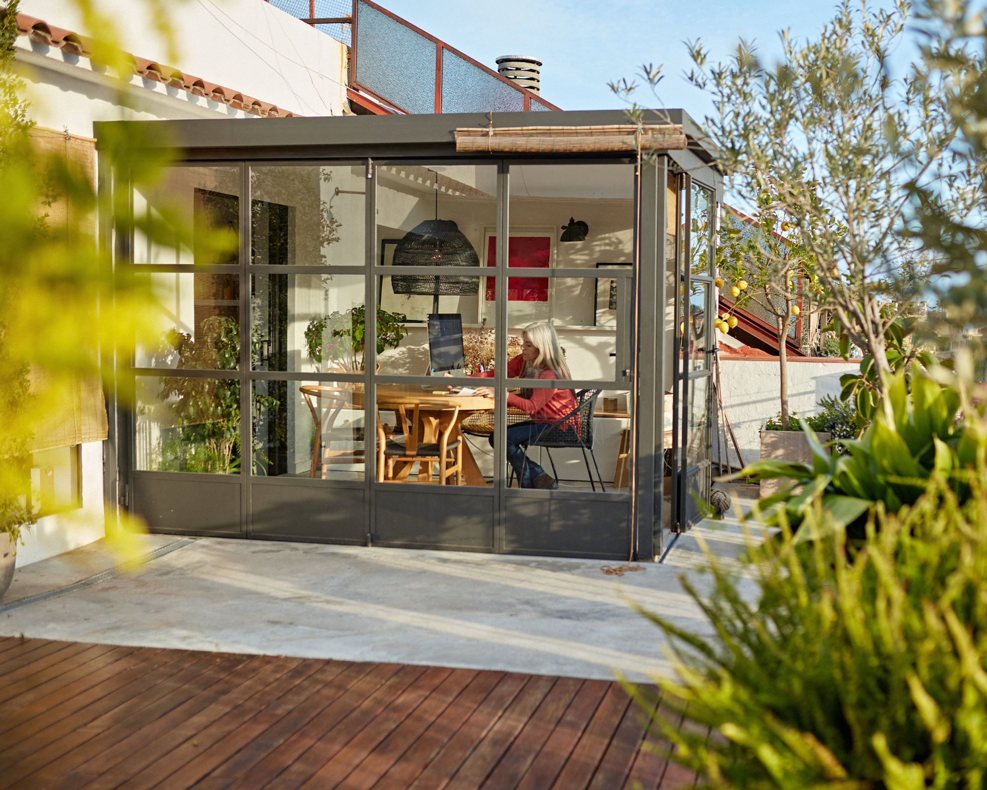 Woman in a modern conservatory
