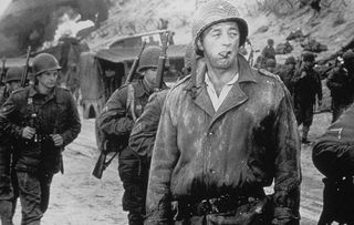 Robert Mitchum as Brig. Gen. Norman Cota in The Longest Day